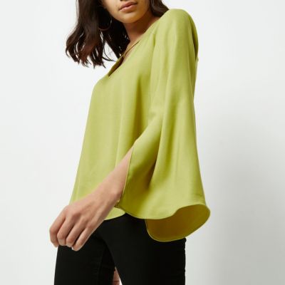 Lime green twist back bell sleeve blouse